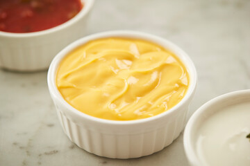 Mustard sauce and various sauces in a small bowl