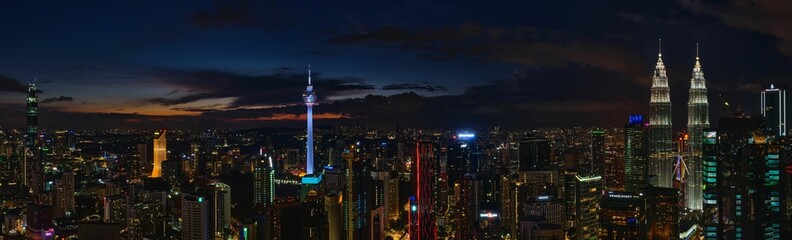 Fototapeta na wymiar Panoramic shot of the urban city of Kuala Lumpur with skyscrapers at night