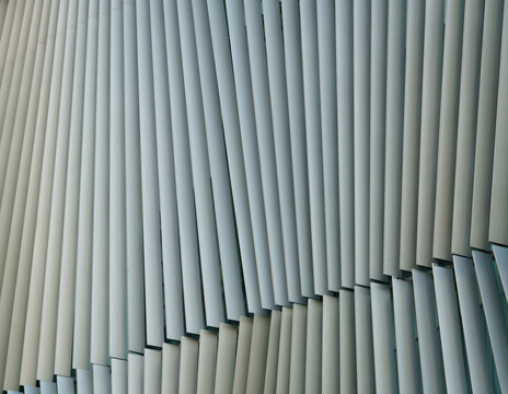 close-up abstract geometry flat pattern of modern architecture exterior facade decoration with metal aluminium material structure background. new futuristic building detail wallpaper concept design.