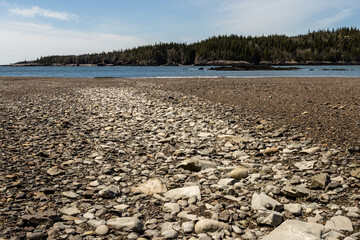 Light rock on Jasper Beach shows the path of a dry creek bed near Bucks Harbor, Maine
