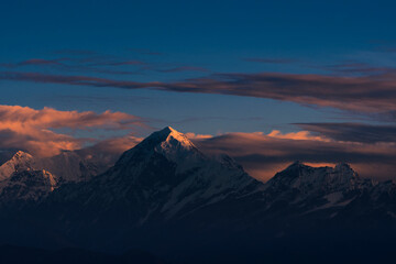 First ray of morning sun on the majestic Kangchenjunga range (third highest in the World) of Himalayas. The highlighted peak is Mt. Siniolchu (6,888 metres) in centre. Photo taken from Sandakphu.