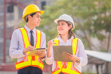 Engineer Construction  concept,Asian engineer construction teamwork  standing on site construction building background, Engineer Construction  design for Business building construction project