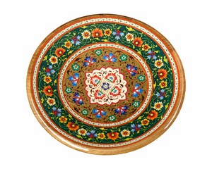 Wooden plate with artistic painting isolated on a white background