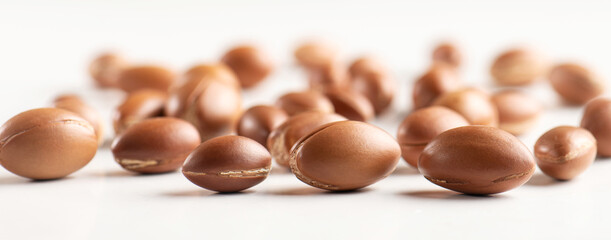 Argan nuts on white background