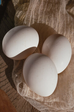 Close-up of white eggs on a napkin.