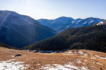 Independence Pass panoramic vista from highway 82 continental divide in autumn Colorado Rocky Mountains with high angle view and early winter snow