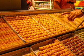 Traditional Turkish dessert baklawa in different flavors and styles in the Egyptian bazaar in...