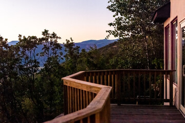 Aspen, Colorado house real estate home with wooden deck railing on balcony terrace and autumn...