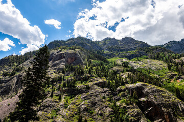 Looking up low angle view of rock canyon wall cliff near Ouray Colorado Million Dollar Highway with...