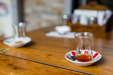 Traditional Turkish tea that is drunk near a cafe on the market street of Istanbul