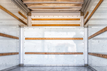Empty interior indoors inside of industrial cargo truck trailer for moving, relocation and loading shipment