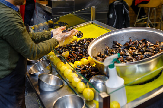 Turkish style appetizer street food stuffed mussels called midye dolma with lemon which is served with a squirt of lemon juice in Istanbul, Turkey