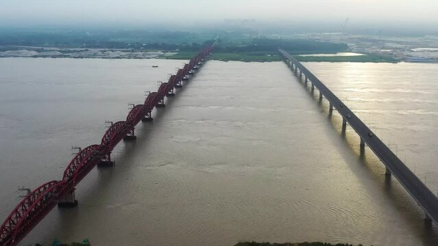 Lalon Shah Bridge, locally known as Pakshey Bridge is a road bridge in Bangladesh over the river Padma. And the Hardinge Bridge is a steel railway truss bridge over the Padma River.