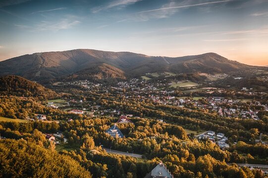 High-angle shot of architecture and beautiful mountains in the background in Ustron, Poland