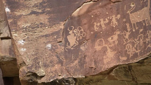 Panning view of Petroglyphs in Nine Mile Canyon from the Fremont Culture with various rock art.