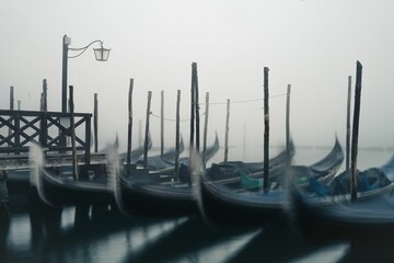Blurred shot of gondolas in the St. Mark's Square, Venice in the early morning