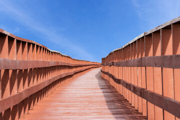 Old bridge in the sun with beautiful sky.