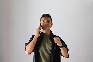 asian boy calling his friend with cheerful face  isolated on white background