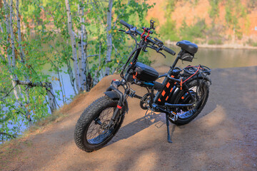 Fototapeta premium Electric Bicycle By the riverside