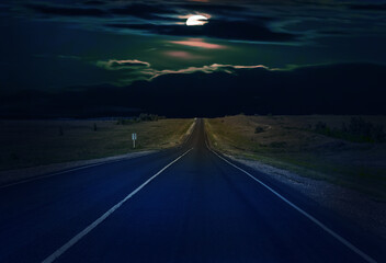 Fototapeta premium Moon in the clouds over a country road