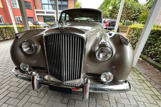 Den Ham, Netherlands - Sept 27 2022 A Bentley S1 with whitewall tires was parked. This car is produced from 1955 until 1959. The S1 was derived from the Rolls-Royce Silver Cloud