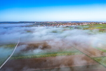 landscape aerial view of fog over fields