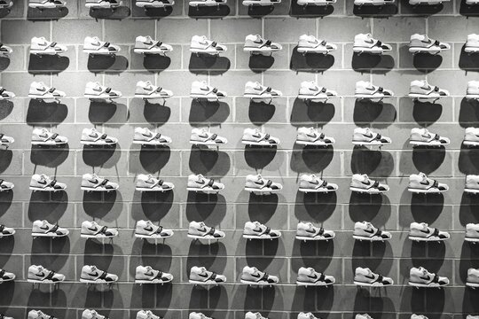 Wall of Nike sports shoes in a shop