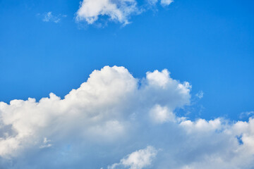 Naklejka na ściany i meble Beautiful clouds on a sunny afternoon