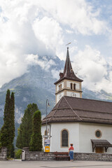 Fototapeta na wymiar Wetterhorn Mountain and church in the Jungfrau Alps at Grindelwald, Switzerland