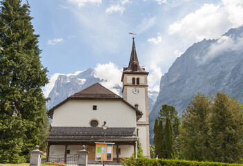 Fototapeta na wymiar Wetterhorn Mountain and church in the Jungfrau Alps at Grindelwald, Switzerland