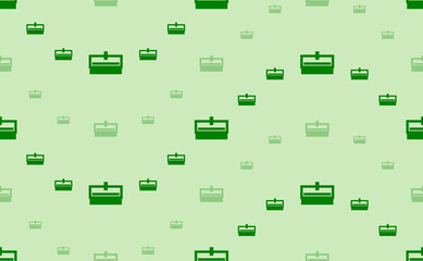Seamless pattern of large and small green cnc machine symbols. The elements are arranged in a wavy. Vector illustration on light green background