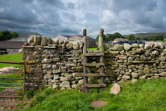 Wooden stile on a hiking path in the Yorkshire Dales, England, UK.
