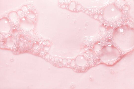 Top View Pink Soap Bar Wet With Bubbles Background