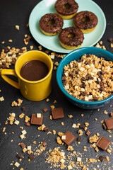 Obraz na płótnie Canvas Chocolate granola cereals with chocolate milk and doughnuts