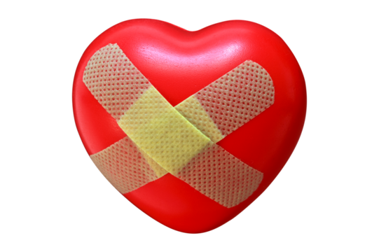 red heart covered with plaster, close up, symbol of love and health, isolate