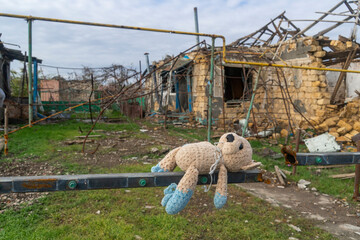 War in Ukraine. 2022 Russian invasion of Ukraine. Countryside. A toy (teddy bear) against the...