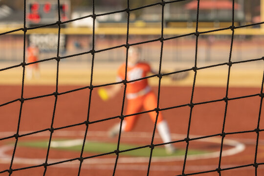 Fastpitch Softball Pitcher Throwing Ball