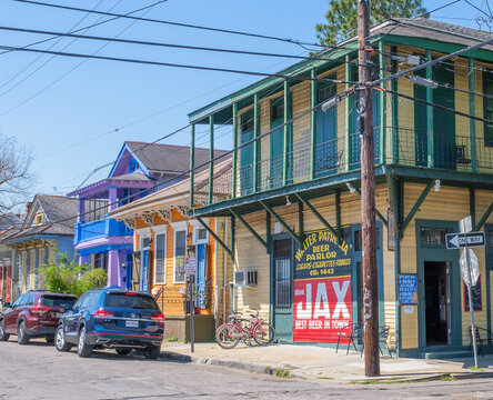 Burgundy Street View of Marie's Bar and Kitchen, Formerly the Walter Patrolia Beer Parlor, with Vintage Jax Beer sign in the Marigny Neighborhood on March 21, 2021 in New Orleans, Louisiana, USA