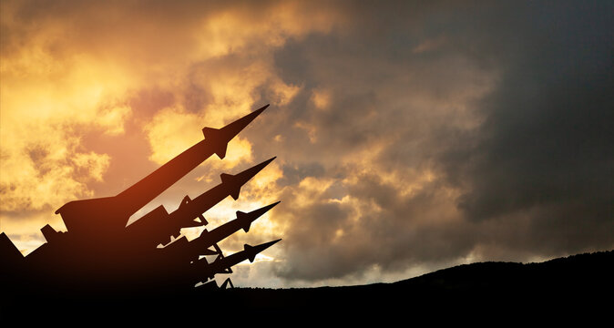 The missiles are aimed to the sky at sunset. Nuclear bomb, chemical weapons, missile defense, a system of salvo fire.