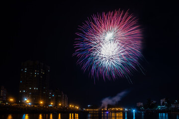 fireworks over the river in the city