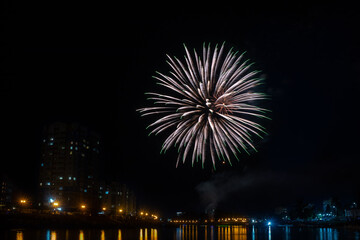 fireworks over the river in the city