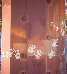 painted hands on a wall