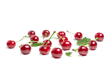 Cherry isolated. Sour cherry. Cherries with leaves on white background. Sour cherries on white