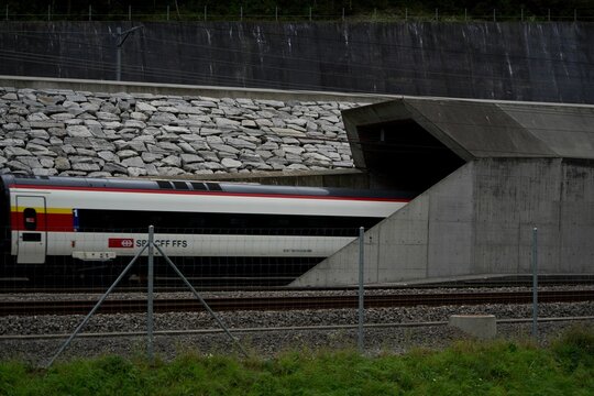 Closeup of an SBB RABe 523 train leaving the Gotthard base tunnel in Switzerland