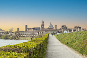 The famous cityscape of Mantua from the bridge over the Mincio at sunset