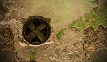 An old air vent with fan in a derelict building in the historic centre of Piran on the coast of...