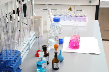laboratory research. Flasks and test tubes on the table. Solutions of different colors and chemicals for sample analysis. Science and technology. Discoveries in science. Environmental studies