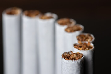 cigarette, cigarette on black background, pack of cigarettes, close-up of a cigarette