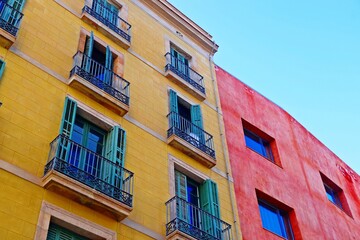 Fototapeta na wymiar Colourful houses and balconies in Barcelona
