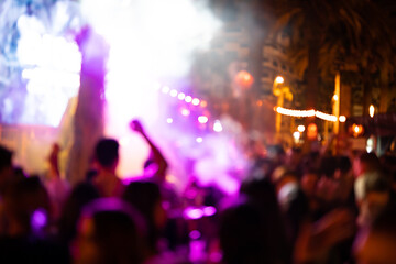 Fototapeta na wymiar Blurred photo of people at a night disco.